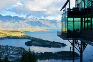 Experience a captivating view of Lake Wakatipu and The Remarkables from the Skyline Restaurant in Queenstown, New Zealand.