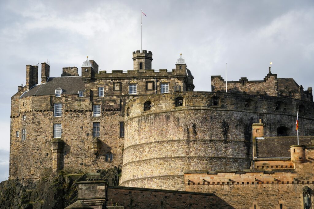 A stunning view of the historic Edinburgh Castle, a prominent landmark in Scotland, captured in daylight.