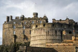 A stunning view of the historic Edinburgh Castle, a prominent landmark in Scotland, captured in daylight.