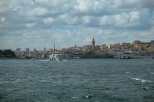 A picturesque view of Istanbul skyline featuring the iconic Galata Tower across the water.